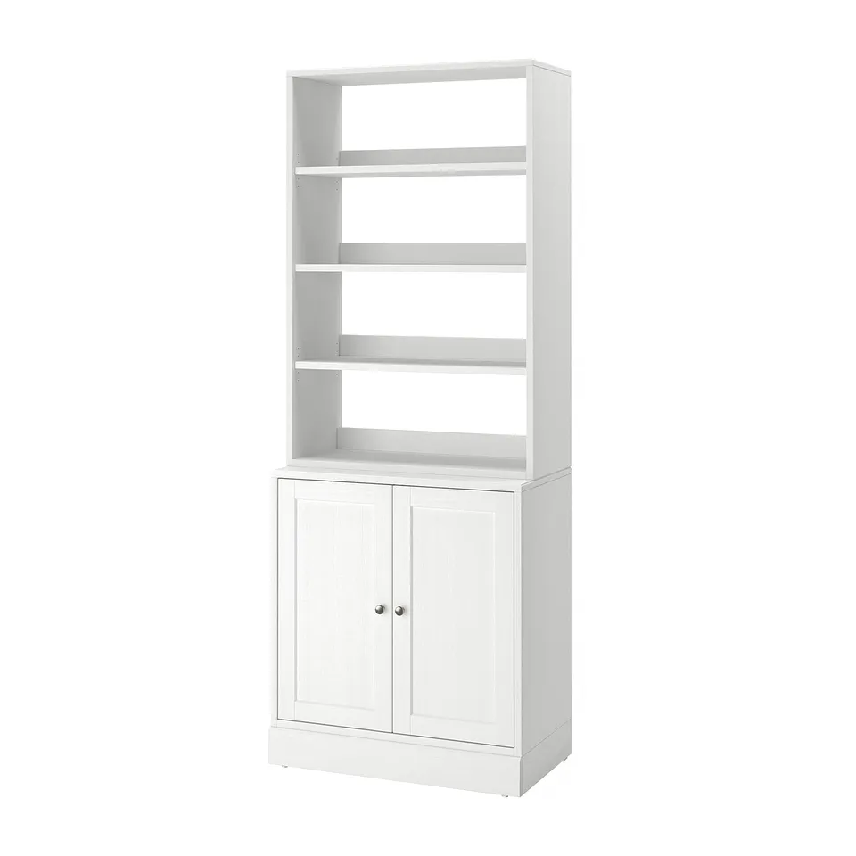 White HAVSTA wooden bookshelf, open shelves and closed cupboard.