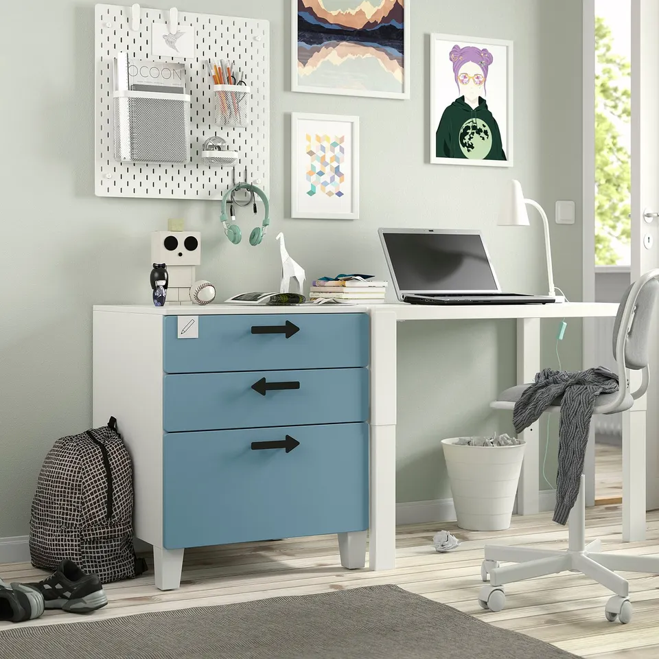 Blue kids desk with laptop.
