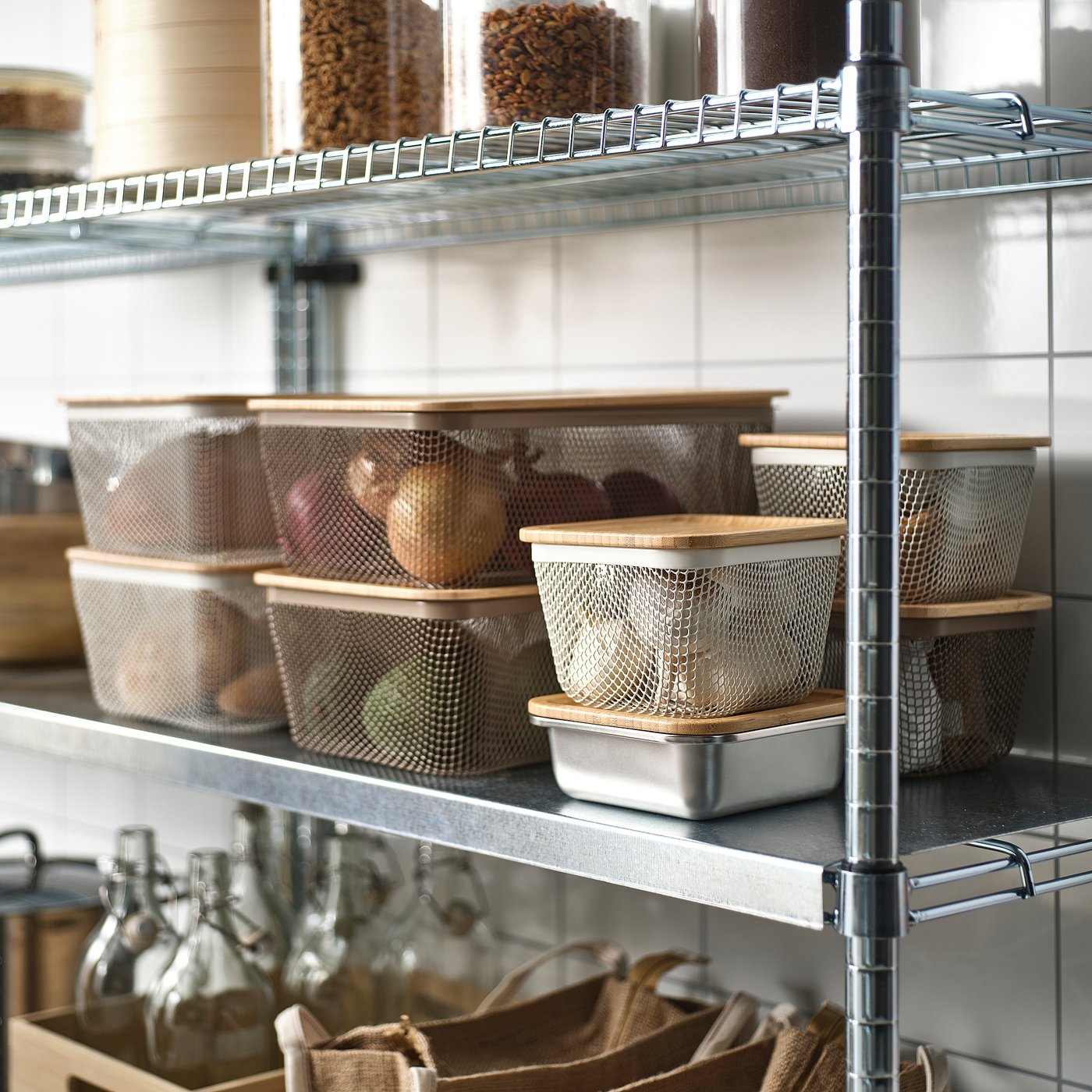 Shelves with IKEA 365+ mesh baskets holding fruits and veggies, promoting air circulation for freshness.