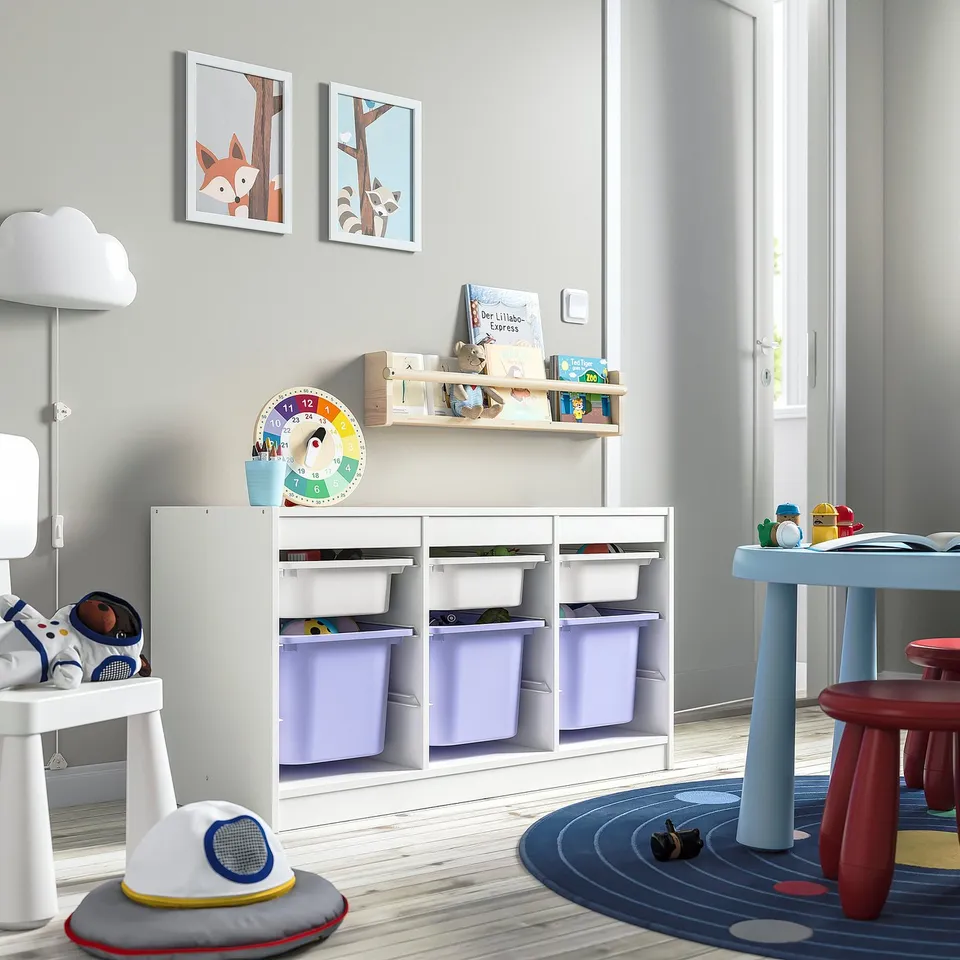 Kids storage unit: TROFAST, white, wood, purple bins, rectangular, wall-mounted with books, toys. Large, fits various items.