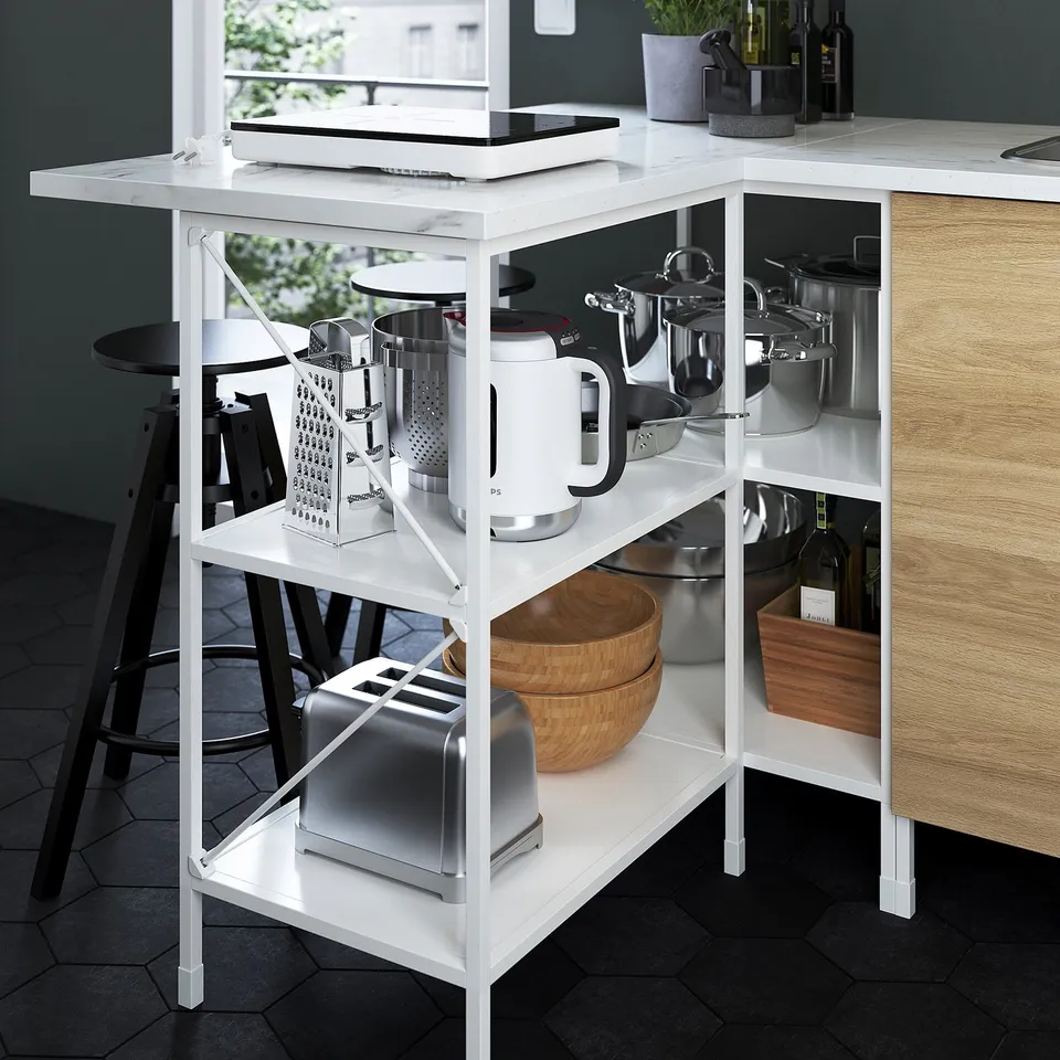 Modern kitchen shelf displaying appliances, pots, and bowls. Open frame design for easy access and visibility, part of the ENHET series.