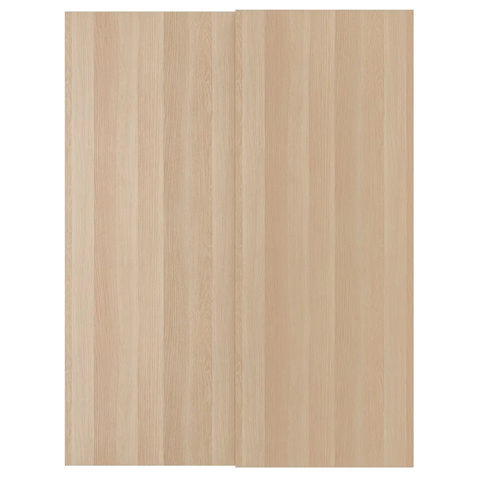 A light-colored wooden sliding door called HASVIK, designed for pax wardrobes, featuring a wood-like finish and sleek, minimalist design.