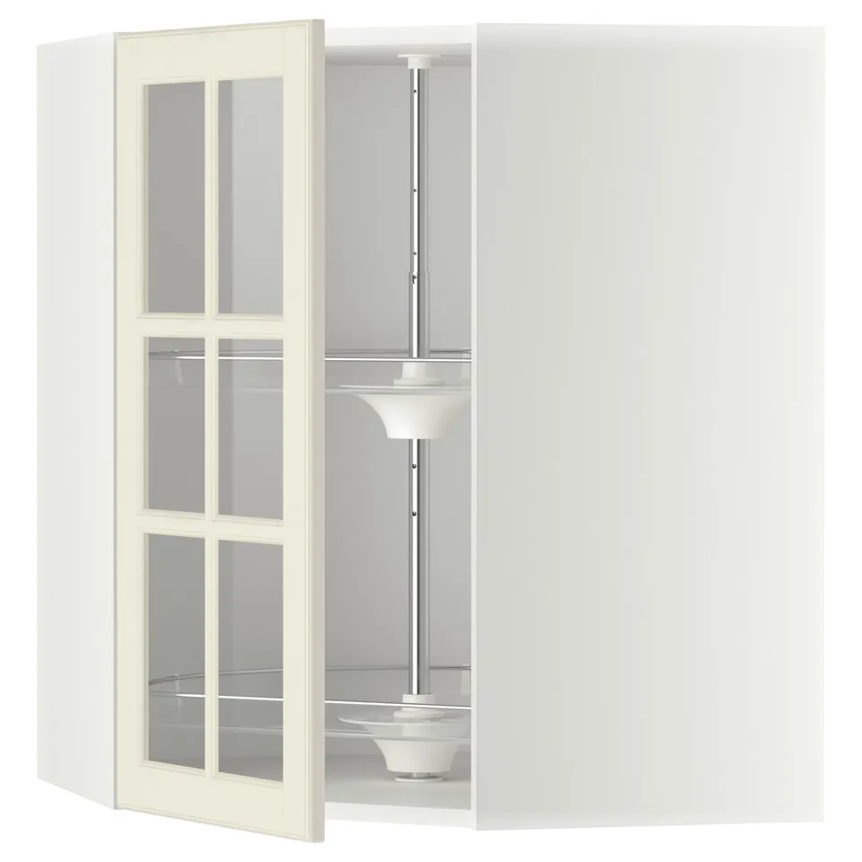 An open white ikea METOD kitchen cabinet with glass doors and a carousel shelf inside.