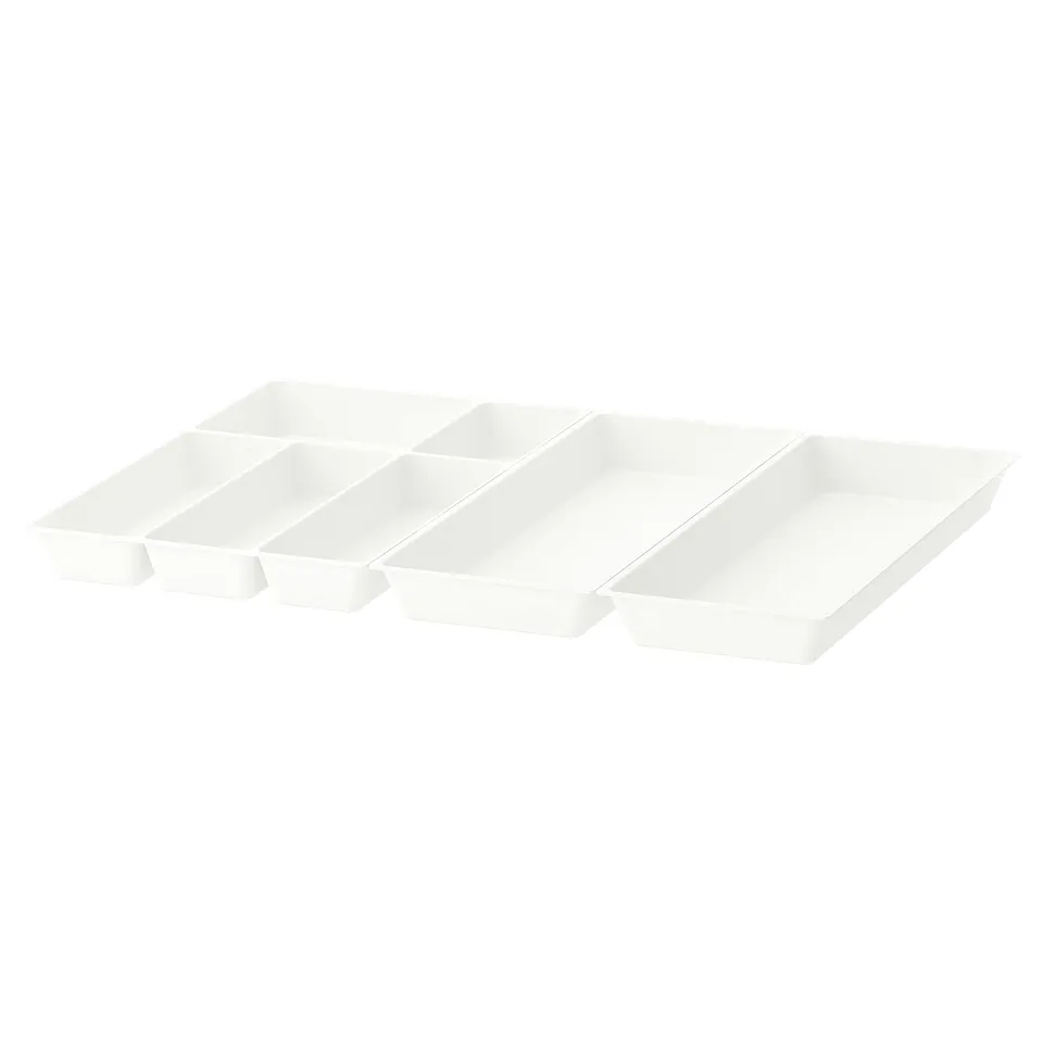 Three white UPPDATERA drawer organisers neatly arranged. Minimalist design for organising drawers.
