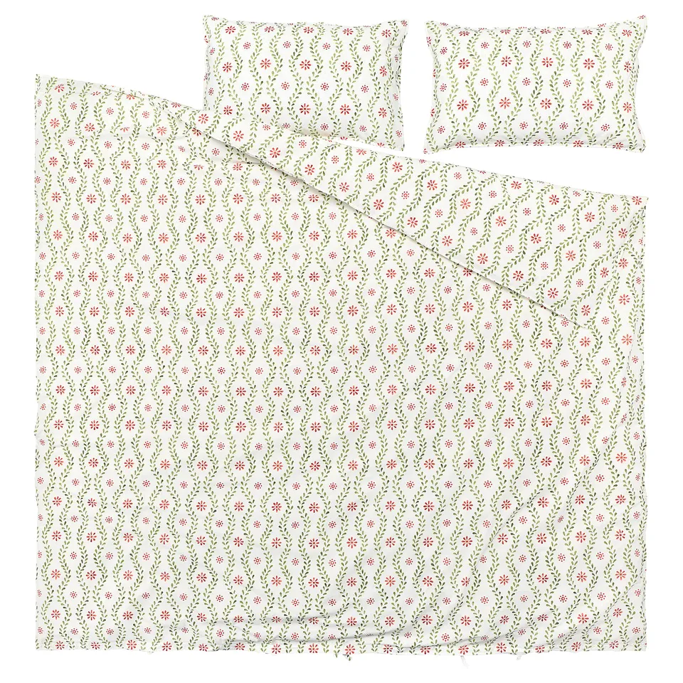 A FYRISVIDE duvet cover set in floral design. White background, red, and green flowers, 100% cotton.