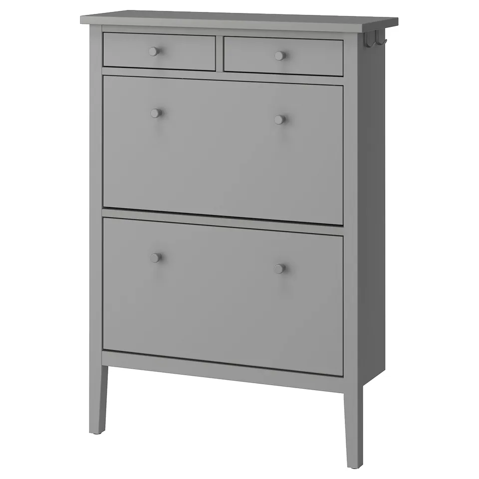 A grey GULLABERG shoe cabinet with drawers, featuring a traditional design with crafted details and wooden knobs.