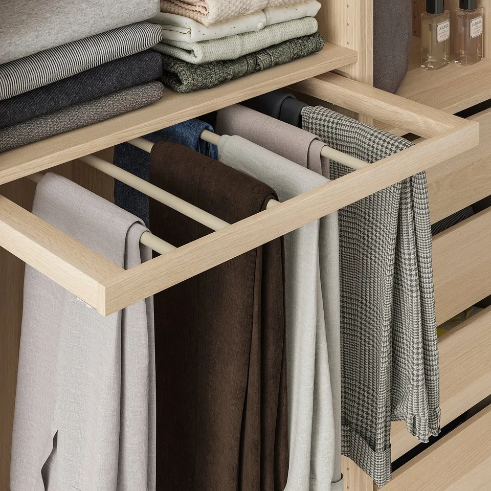 Wooden closet organiser with 6 arms, holding neatly folded pants on each. The pull-out design allows easy access to each pair.
