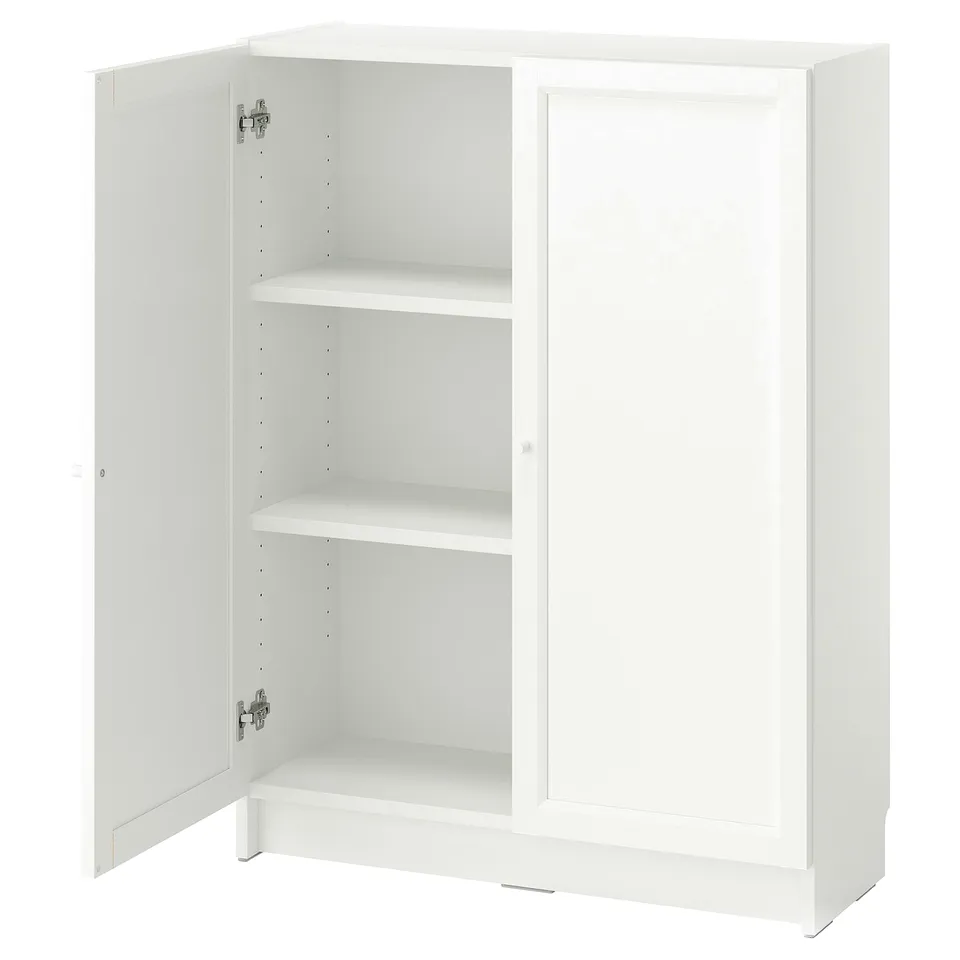 A white BILLY bookcase with two open doors, revealing adjustable shelves inside. Its simple, square design offers versatile storage.