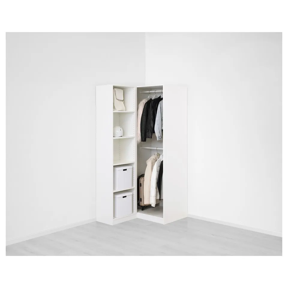 Modern white wardrobe with mirror doors in a corner, showcasing spacious shelving and hanging space for clothes.