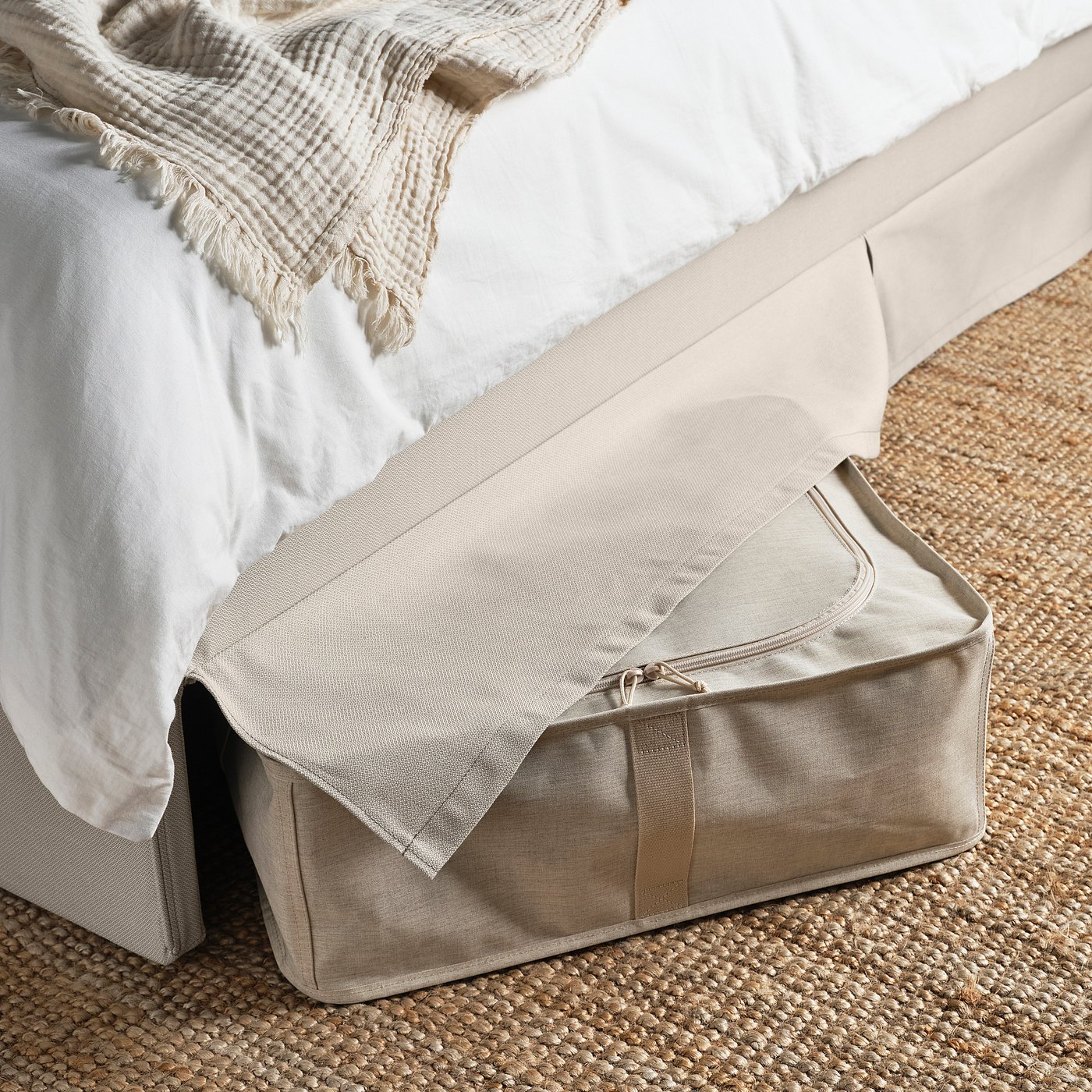Bed with RAMNEFJÄLL frame. Shows easy-to-clean, padded headboard and space under bed for storage.