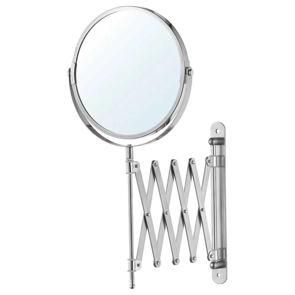 A chrome FRÄCK vanity mirror with an extendable arm and a magnifying side.