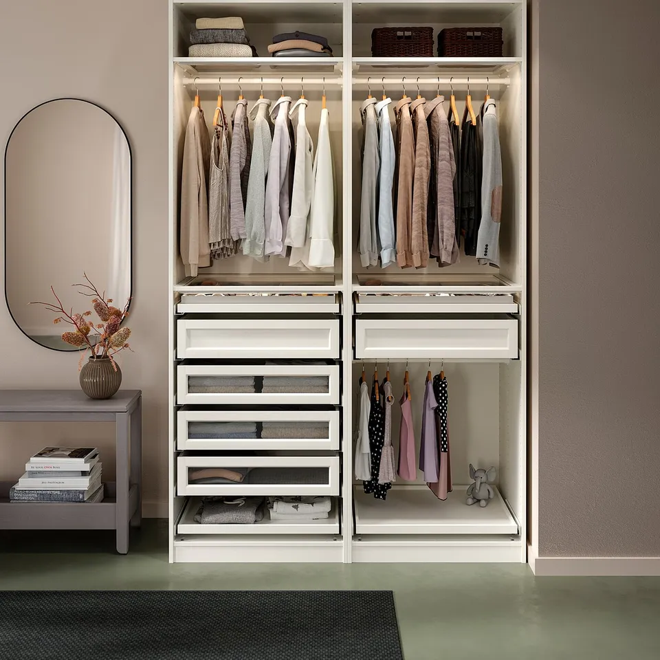 PAX wardrobe: white, sleek, rectangular, organised clothes storage with hanging rails and shelves.