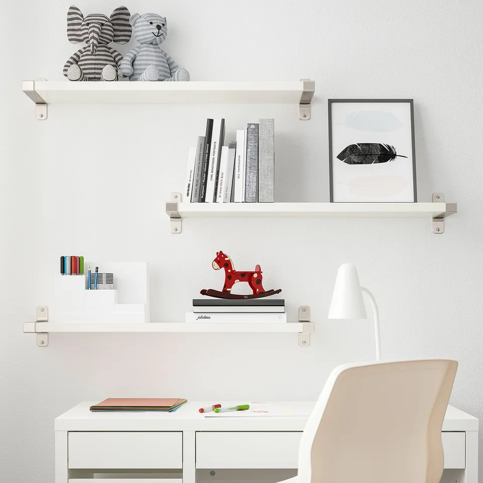 BERGSHULT shelves with toys, books, chair, and desk.