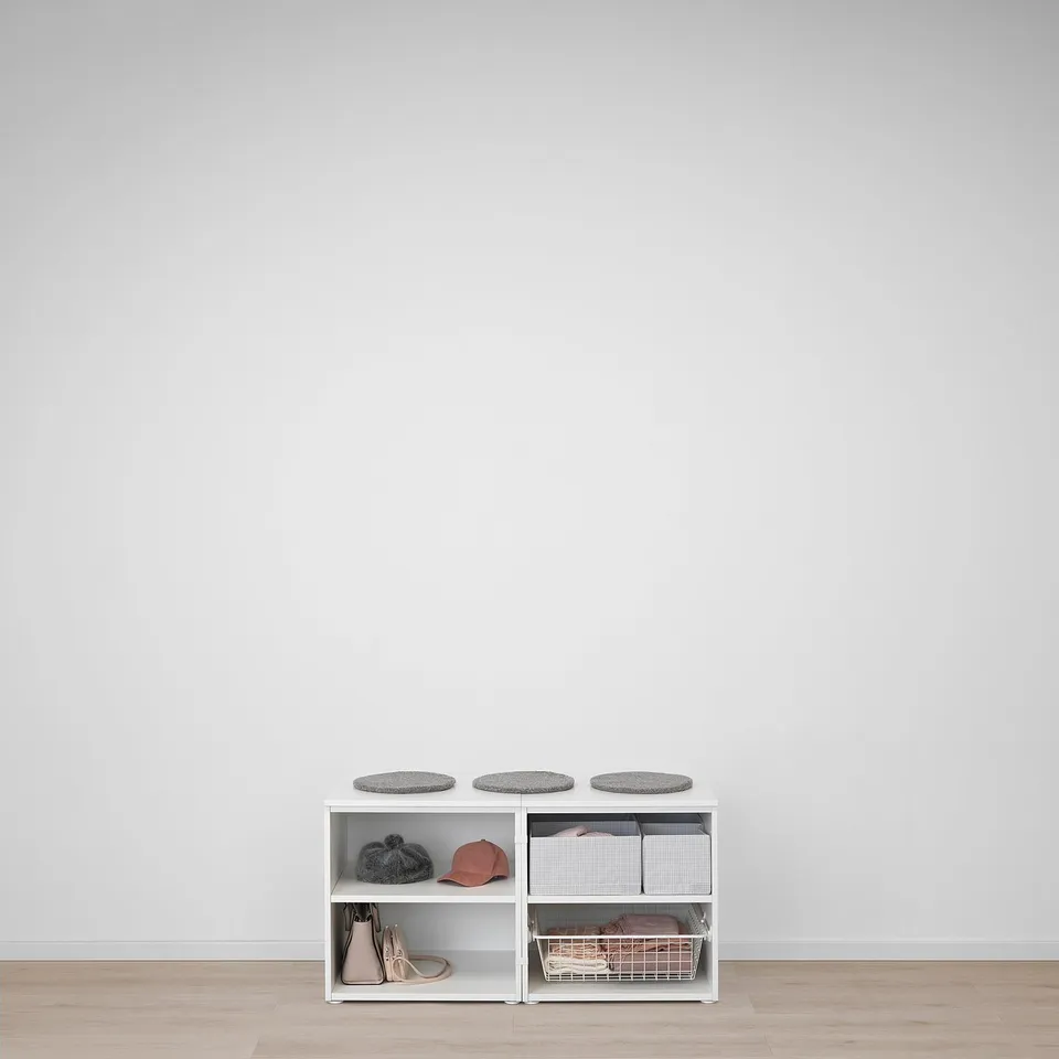 White PLATSA storage unit with shelves and grey felt pads, holding hats, shoes, and a basket.