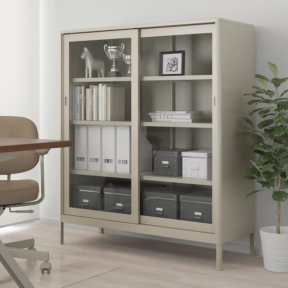 IDÅSEN beige bookcase with glass doors, organised books & storage.