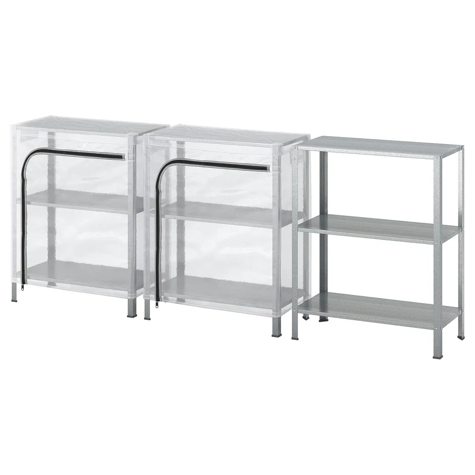 Three silver metal shelving units, two with transparent dust covers.