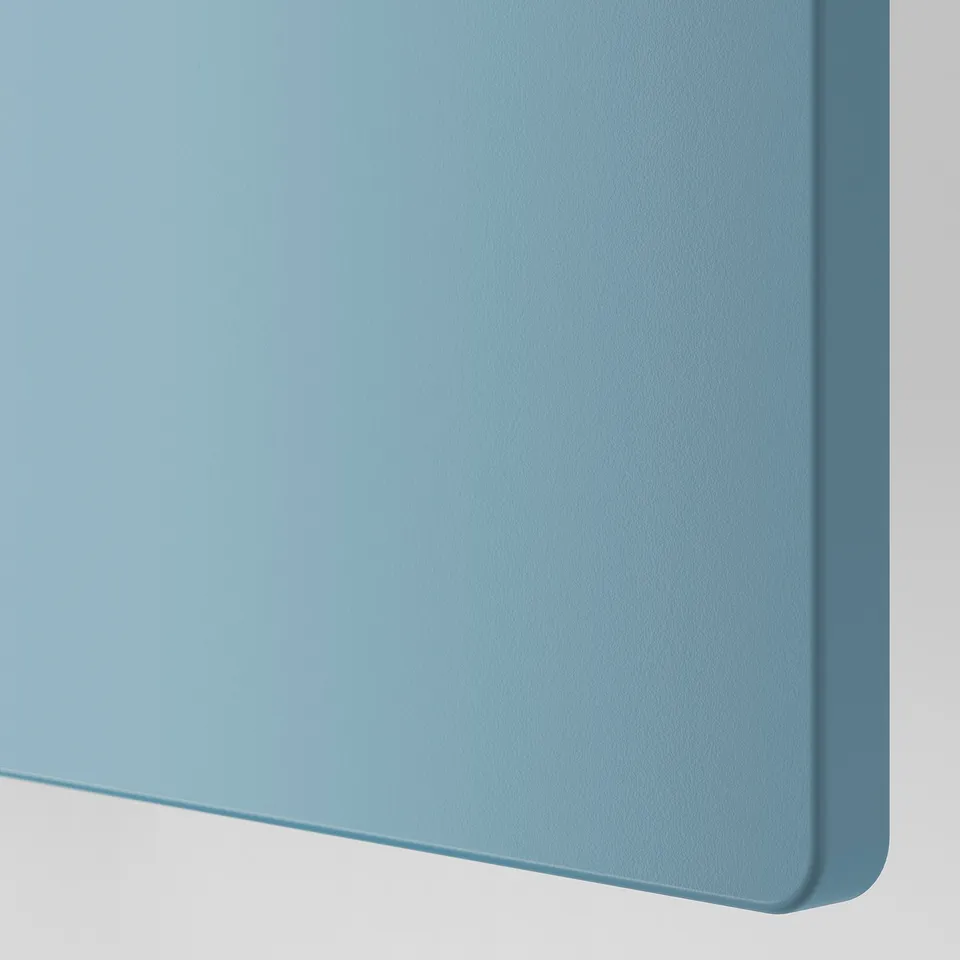 A smooth, light blue pastel surface, likely a storage door, with rounded edges showcasing high-quality finish.