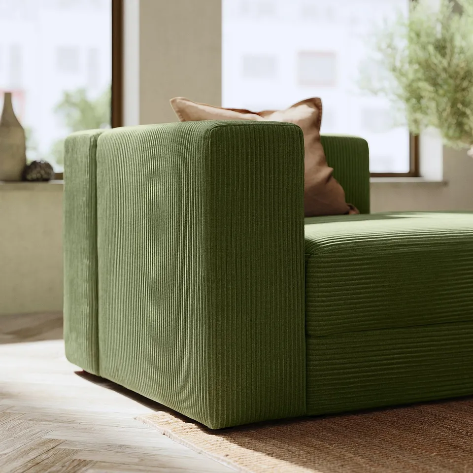 Modern green corduroy sofa, soft cushions, sleek design, matches any decor.