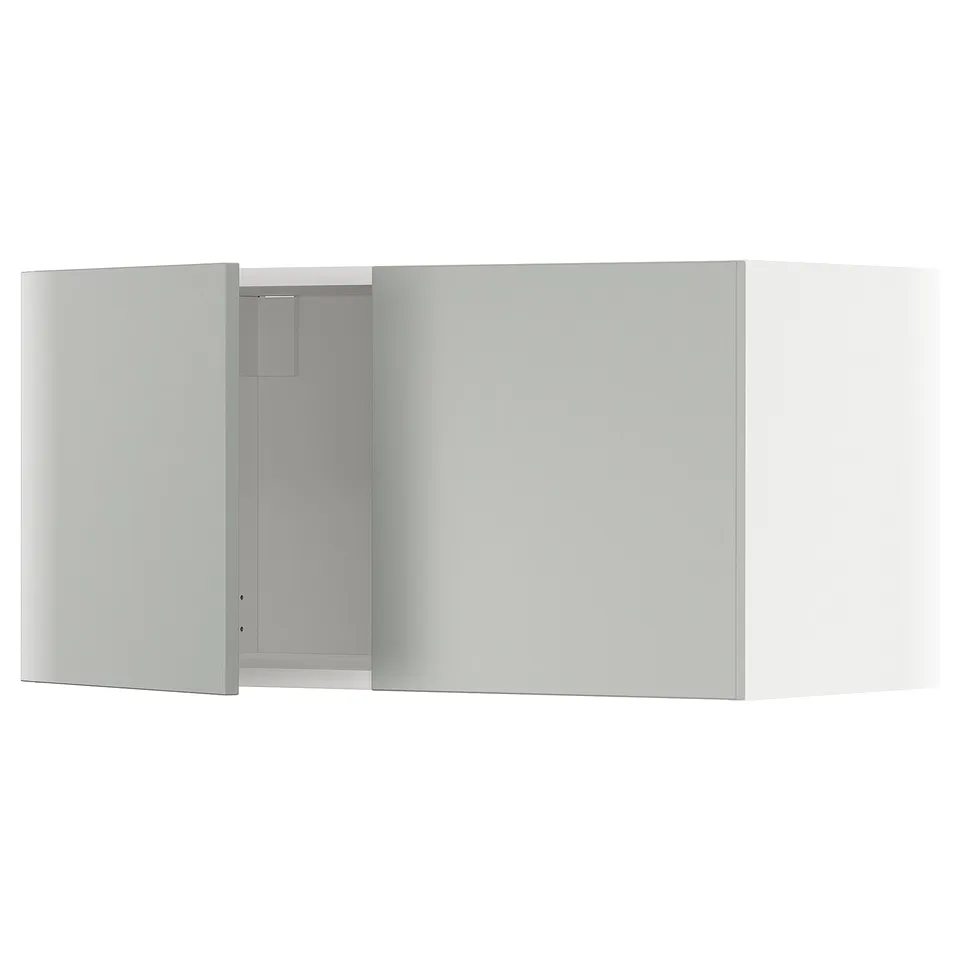 A modern, light grey METOD kitchen cabinet with minimalist design. It a flat, rectangular shape and sleek, smooth surfaces.