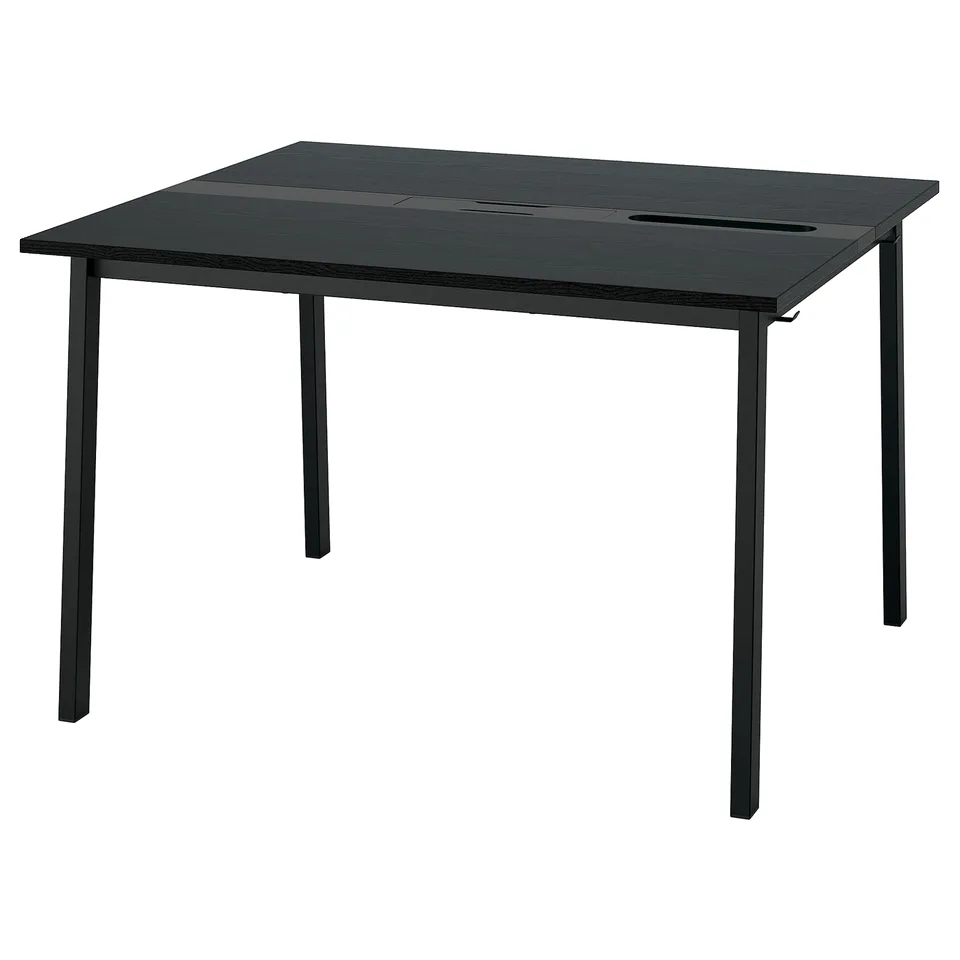The MITTZON conference table is black, rectangular, with metal legs, and has built-in cable management.