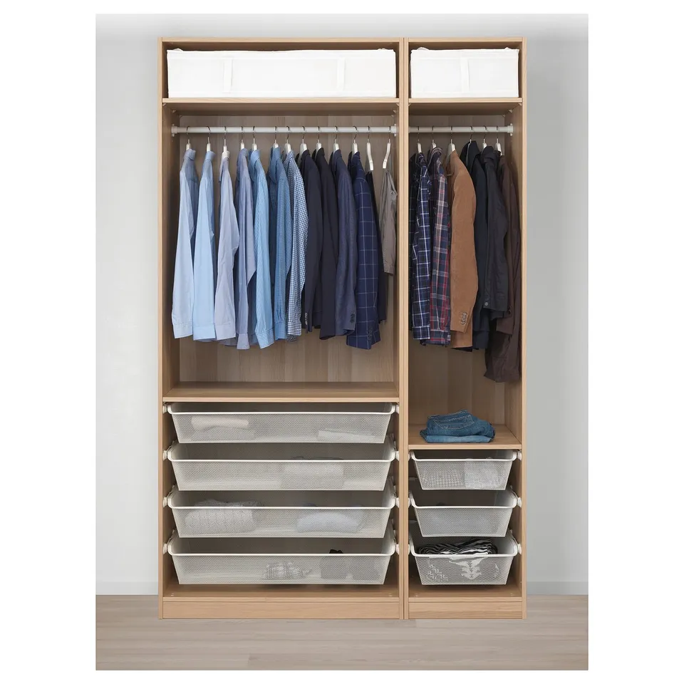 Wooden wardrobe with hanging shirts and jackets, shelves, and storage baskets.