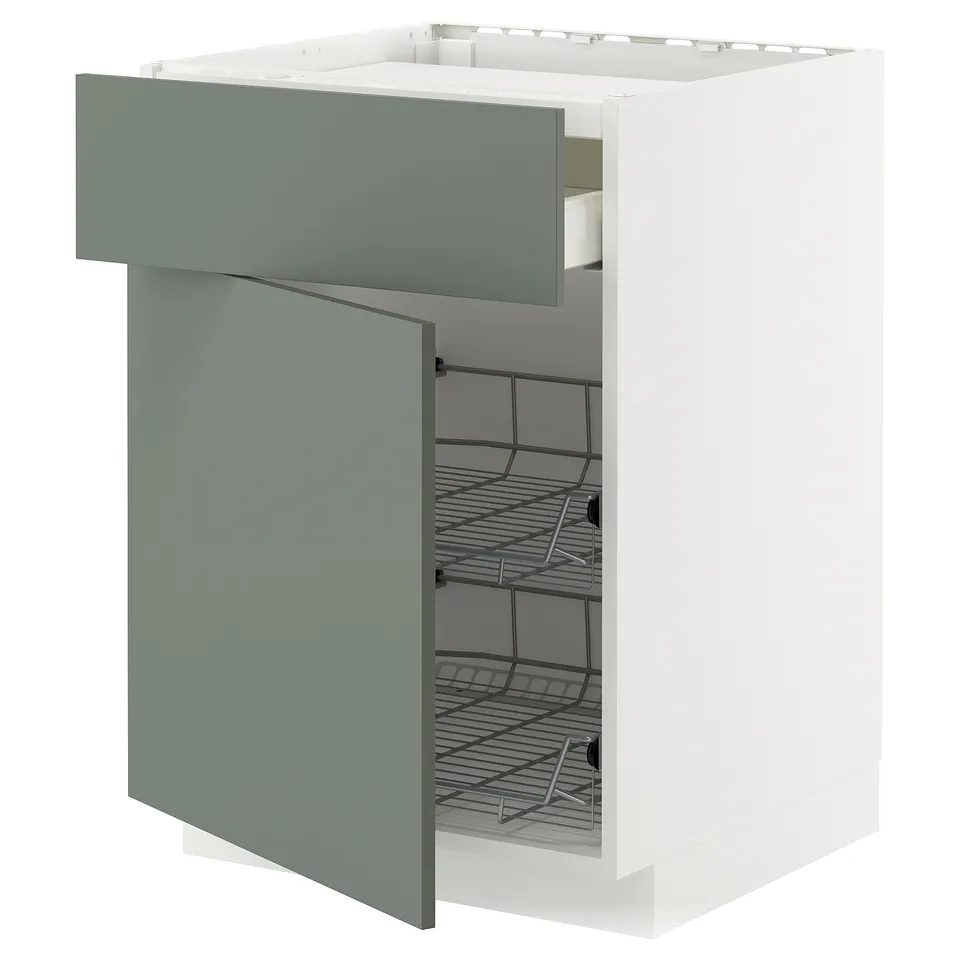 Modern kitchen cabinet with grey-green nickebo doors, open to show wire baskets, white frame.