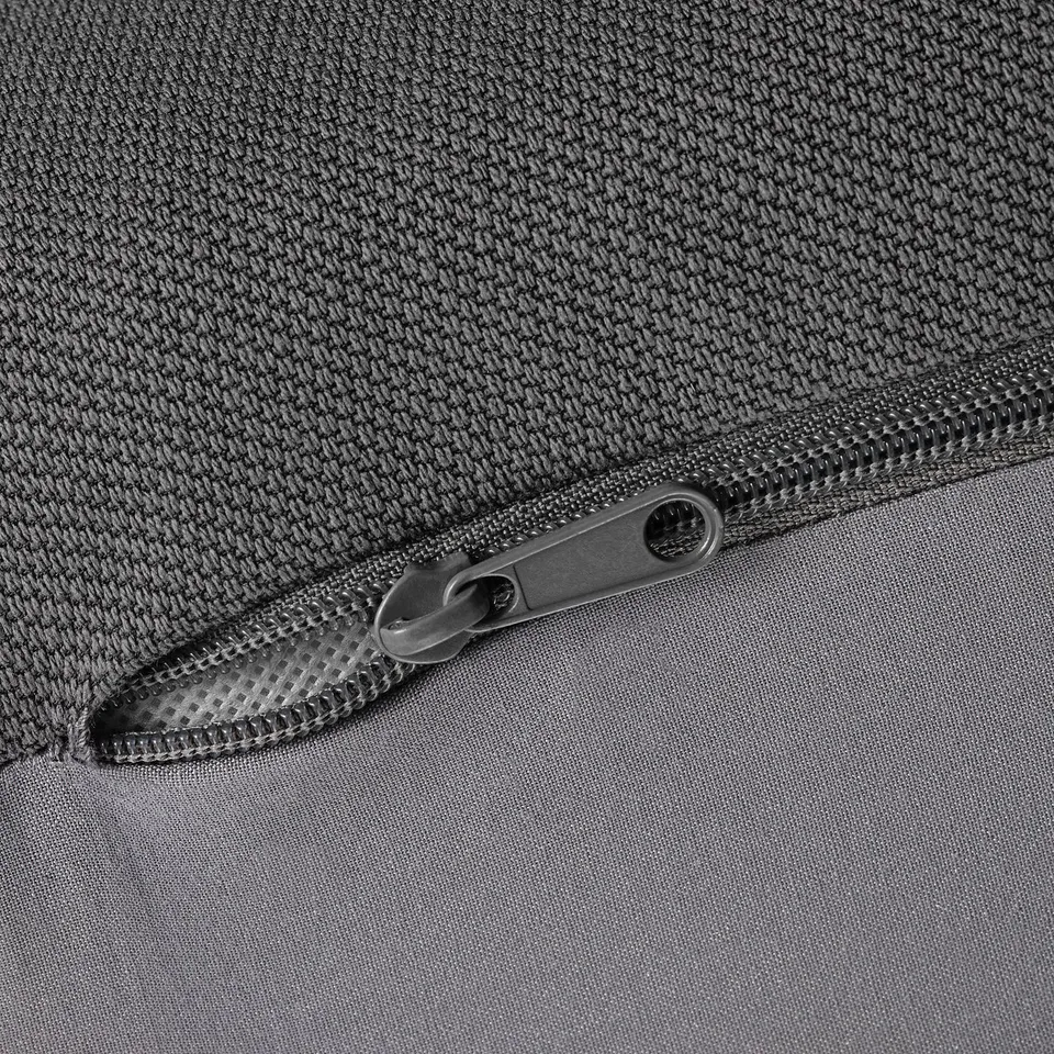 Closeup of high-quality zip on durable, textured fabric bag.