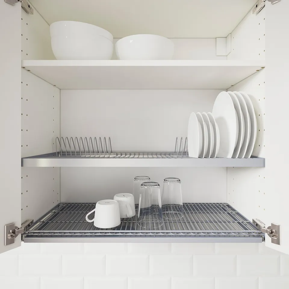 Wall-mounted dish drainer stores dishes in cabinet, freeing counter space.