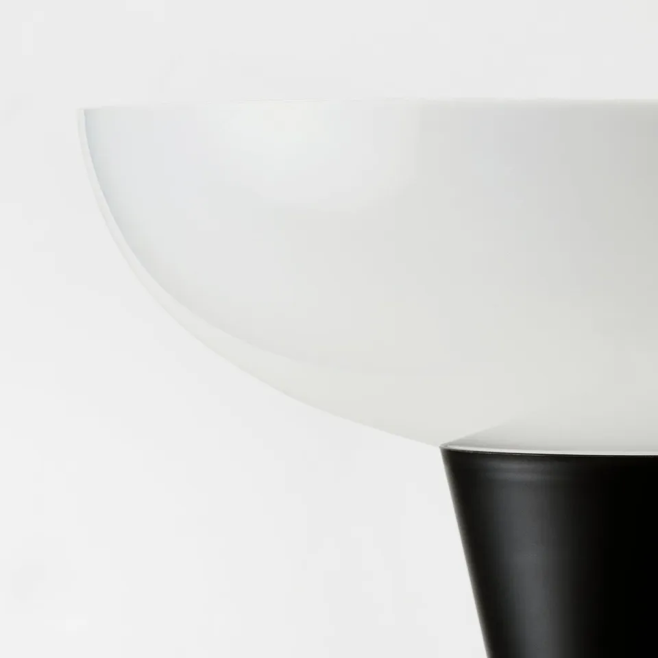 Modern minimalist lamp. White shade, black base. Elegant curve design.