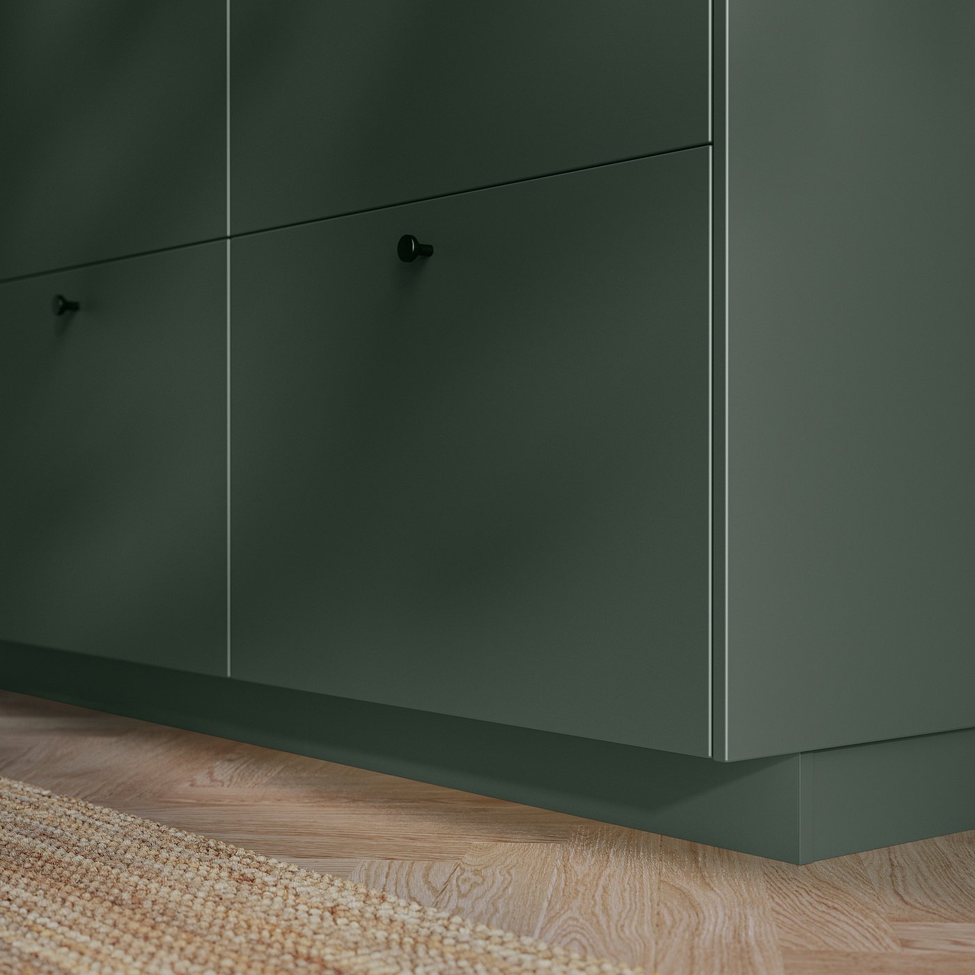 Dark green HAVSTORP kitchen cabinets, sleek design with smooth surface and minimalist handles.