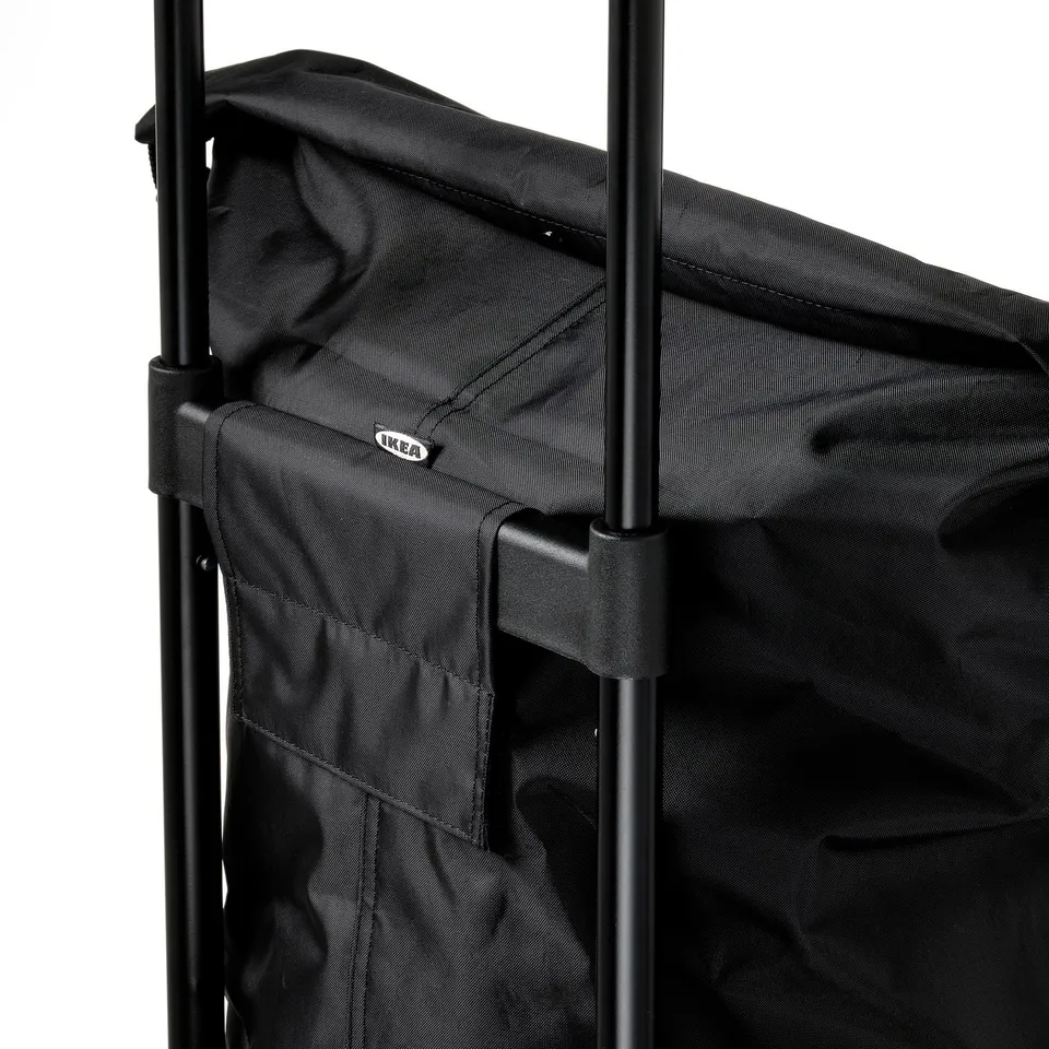 Black fabric bag with metal frame, sturdy handle, well-stitched seams, IKEA label visible.