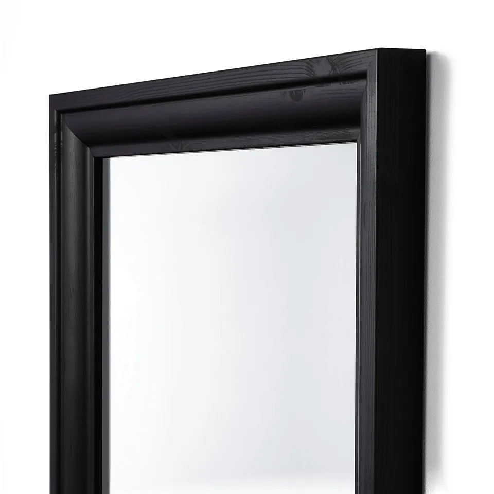 Black-framed full-length mirror, sturdy and sleek, ideal for bathrooms or living spaces, with safety film on glass.