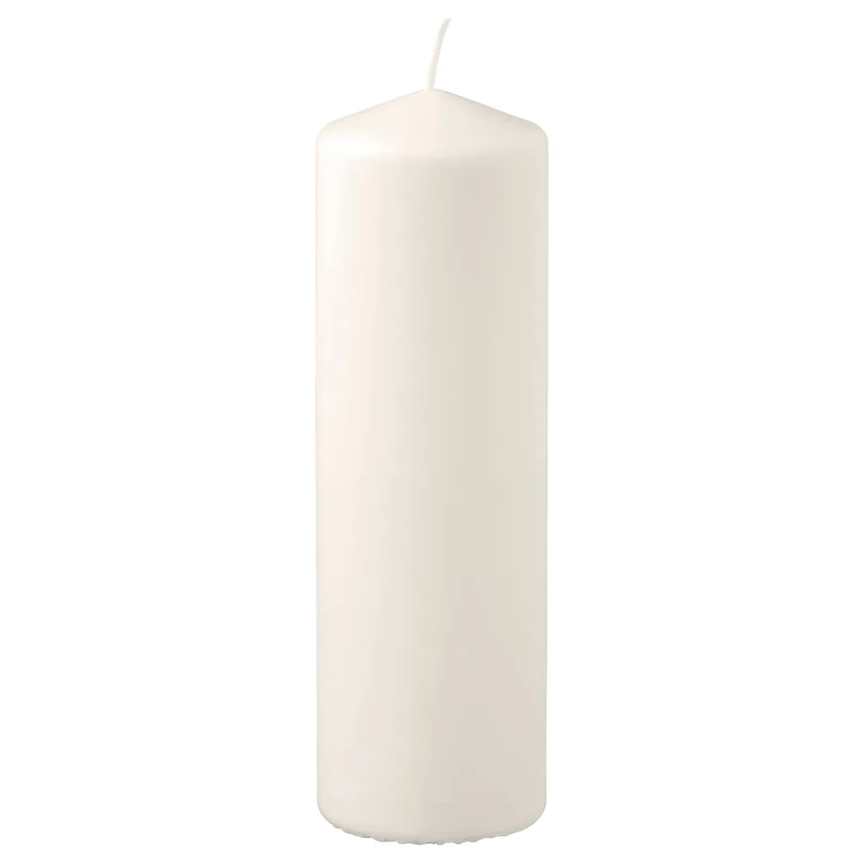 Single white pillar candle, smooth, cylindrical with slightly tapered top, made of plant-based and paraffin wax.