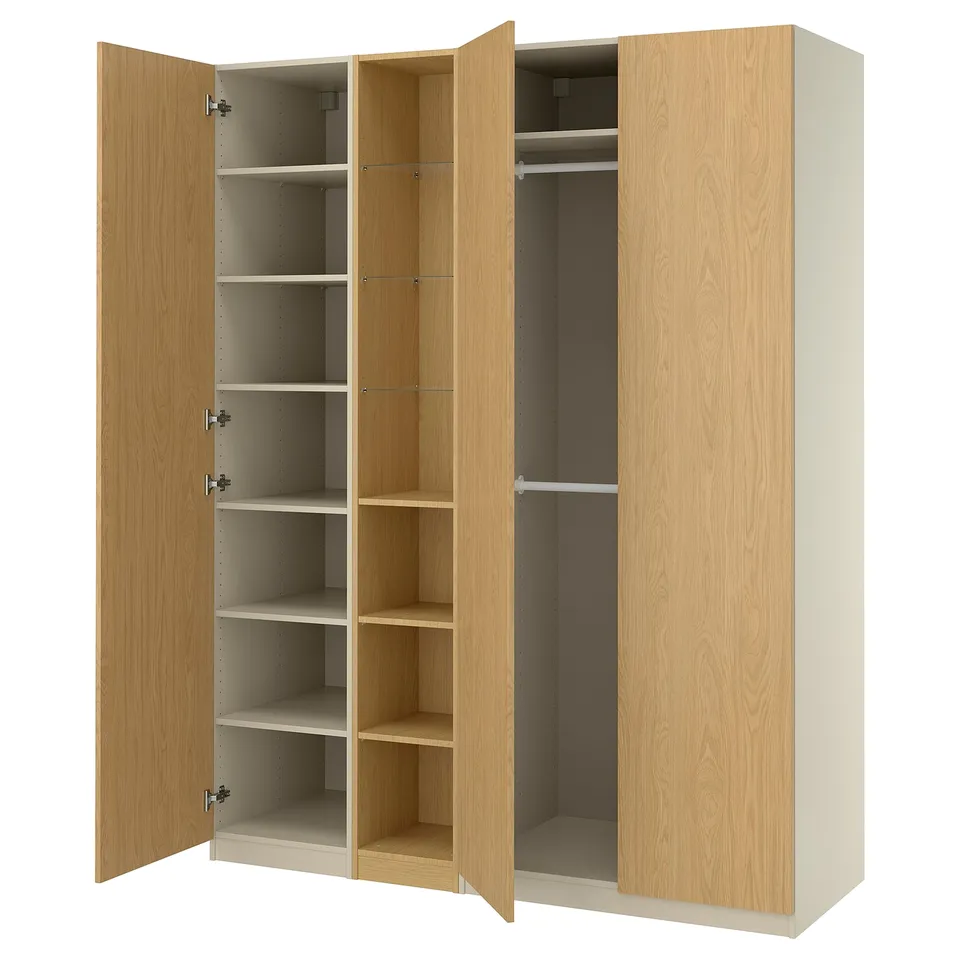 Wooden PAX wardrobe shown open, light oak, rectangular, four large doors, multiple shelves and hanging space.