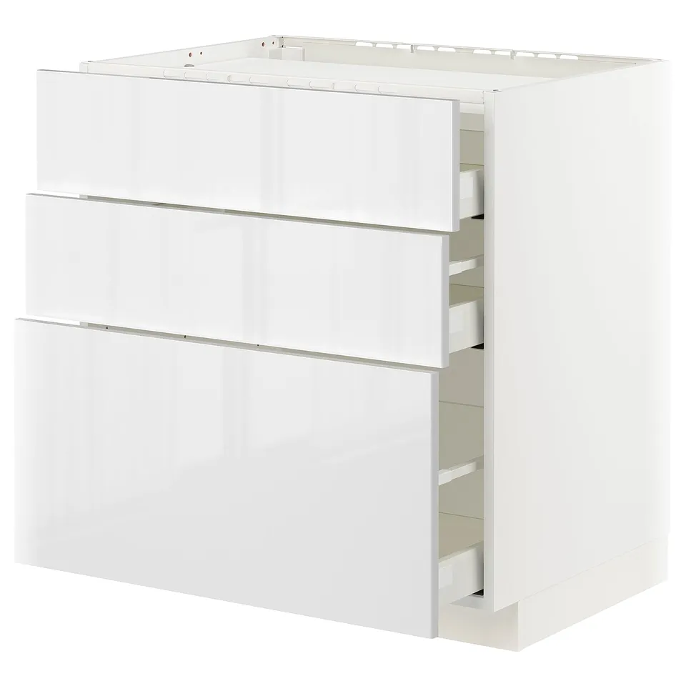 White METOD kitchen unit with glossy drawers and smooth edges.
