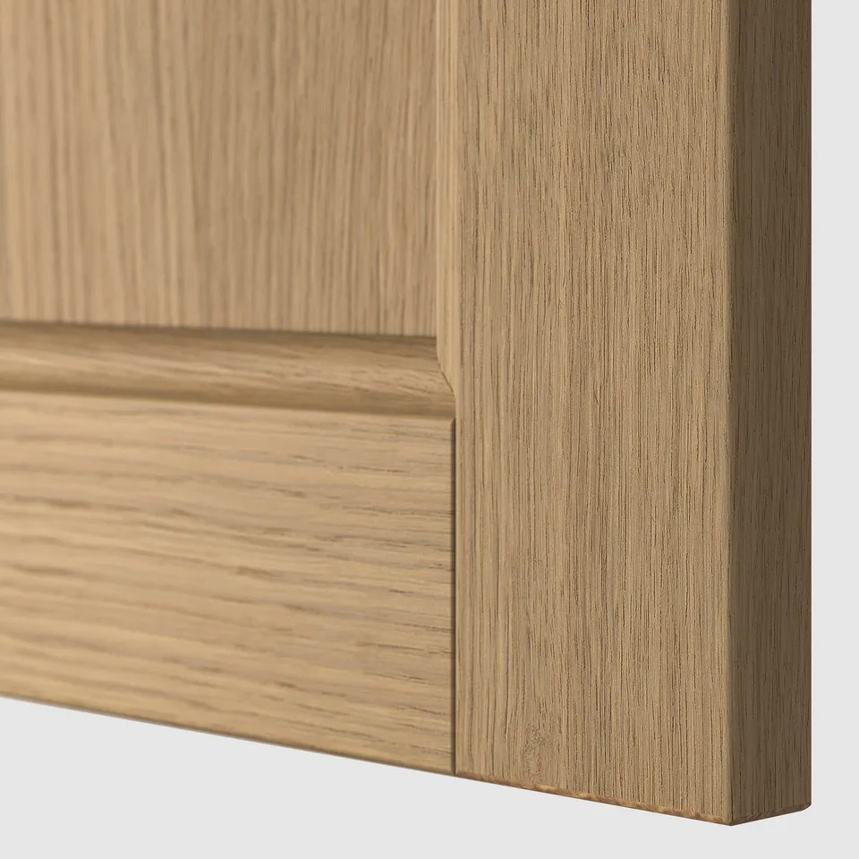 Close-up of smooth, light wooden cabinet detail, showcasing fine grain texture and craftsmanship.