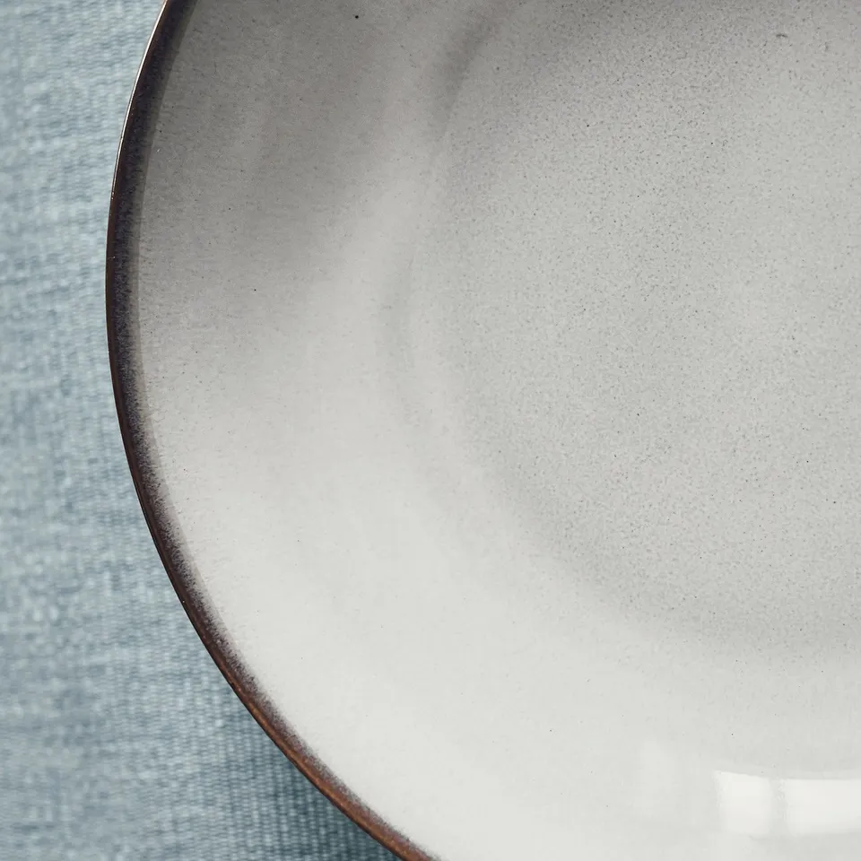 Deep glazed plate, pristine & textured.