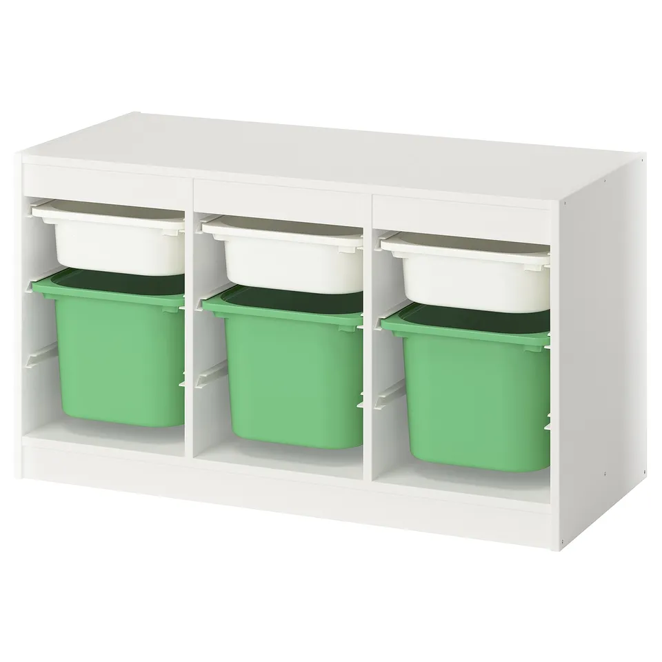 A TROFAST white storage unit with green plastic bins.