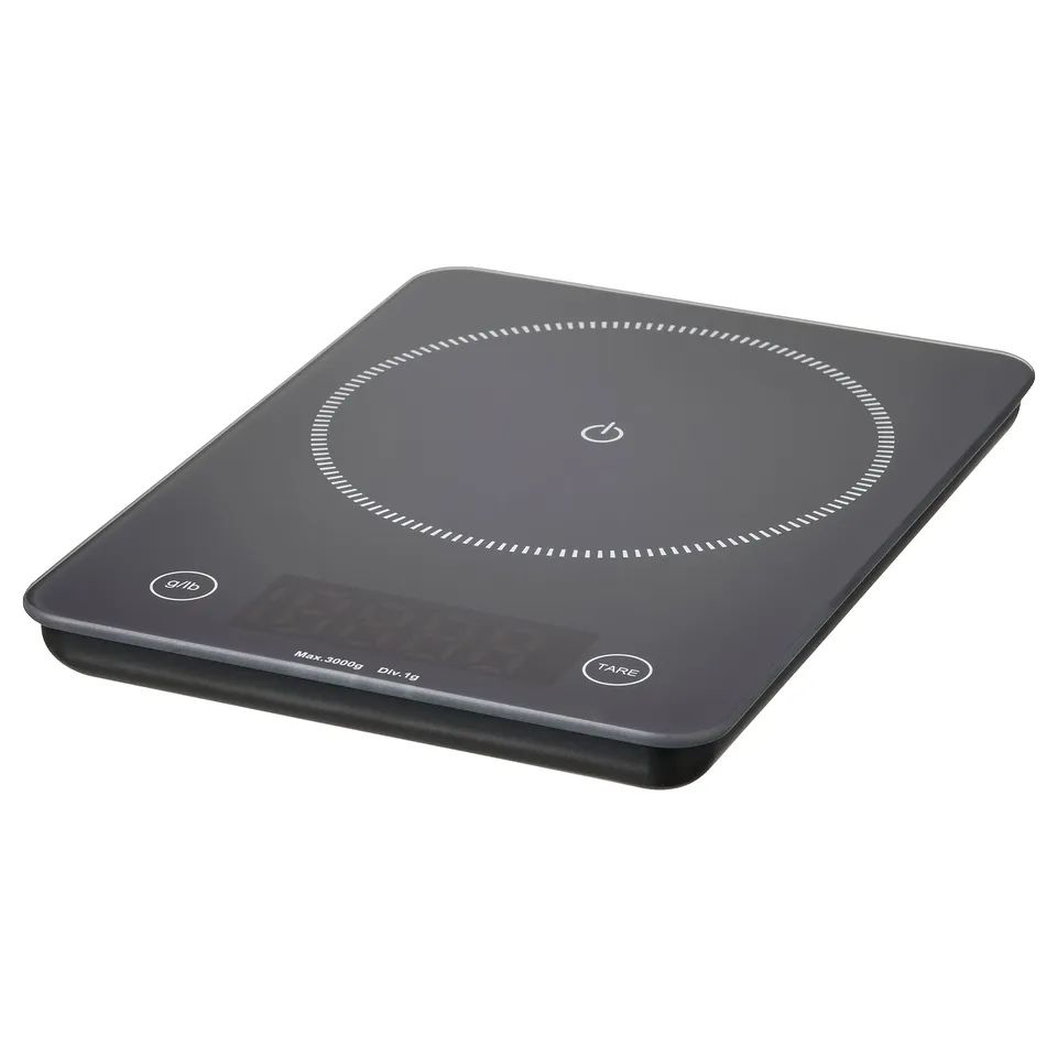 GENOMSNITT dark grey digital scale, rectangular, glass top, plastic base, precise kitchen tool.