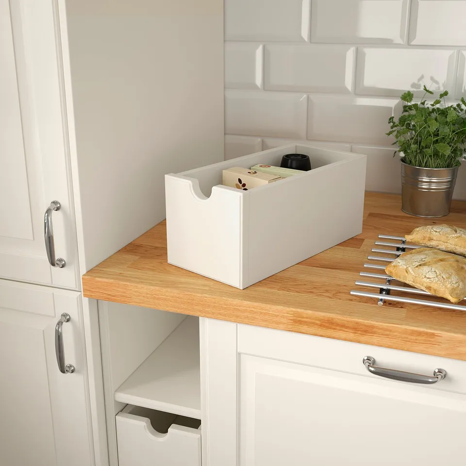 White storage box on kitchen counter, holding items for easy access. Part of TORNVIKEN series for flexible organisation.