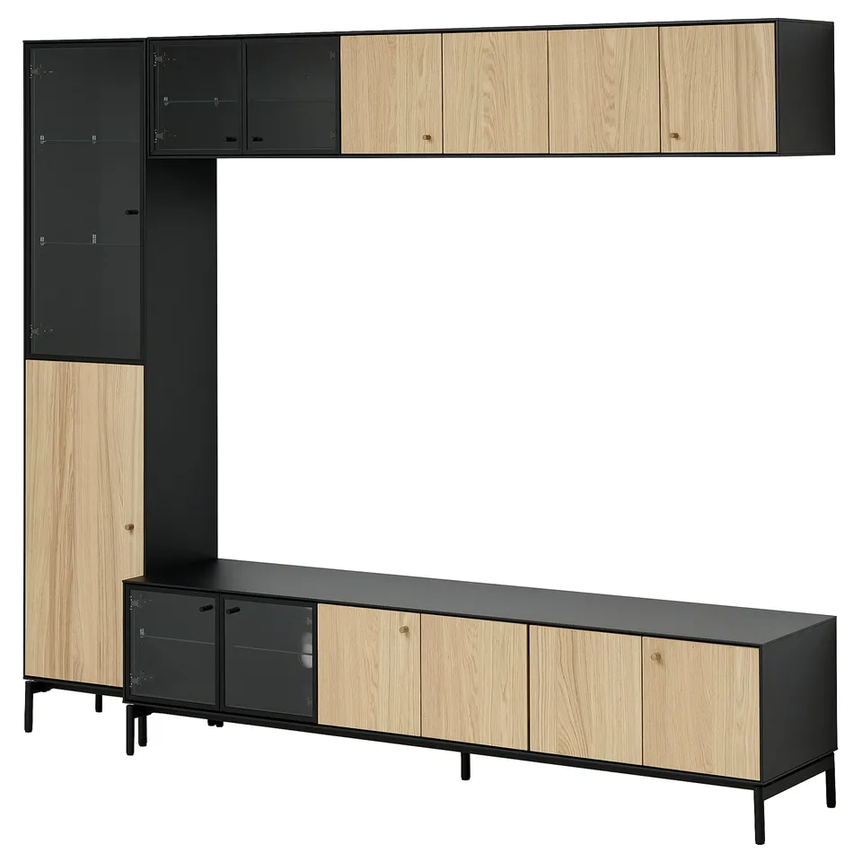 A BOASTAD storage unit in black and oak. It sleek lines, combination cabinets, and glass doors for displaying items.