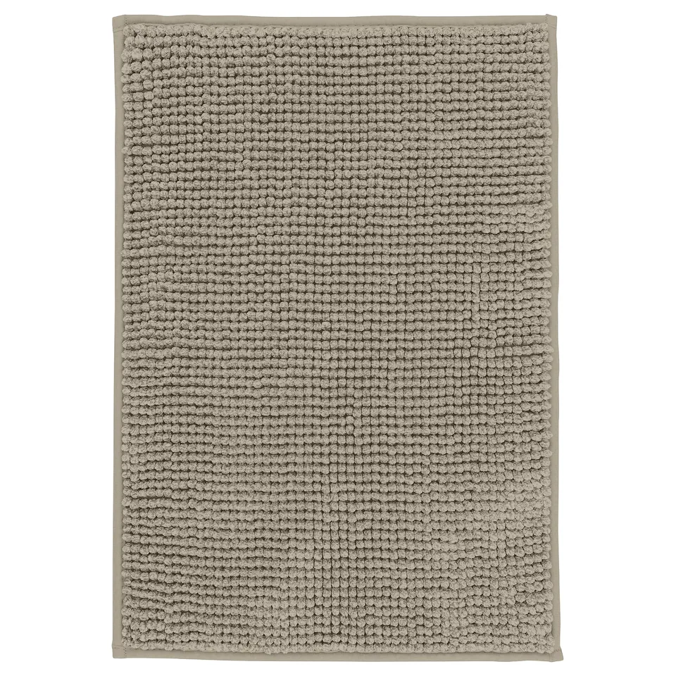 Rectangular grey bath mat, textured with raised dots, soft and quick-drying.