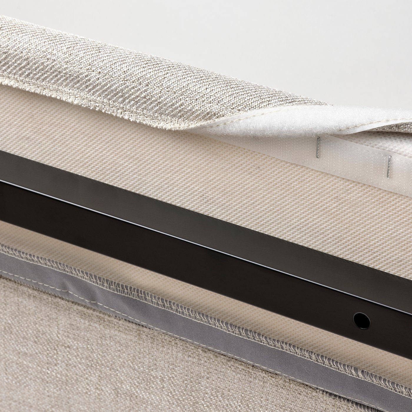 Close-up of RAMNEFJÄLL bed cover; machine washable, easy to remove and put back on.