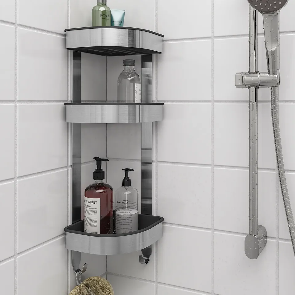 BROGRUND 3-tier shelf in bathroom, holding toiletries near shower head with hooks.