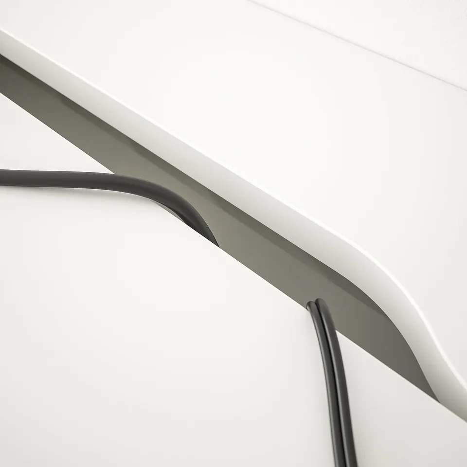 Modern desk with built-in cable management and sleek storage drawers.