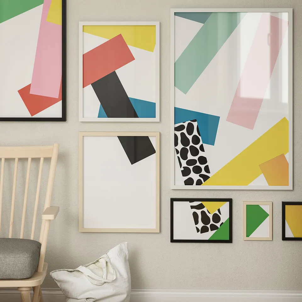 Modern art frames in various colours and sizes, hung in a vibrant gallery wall.