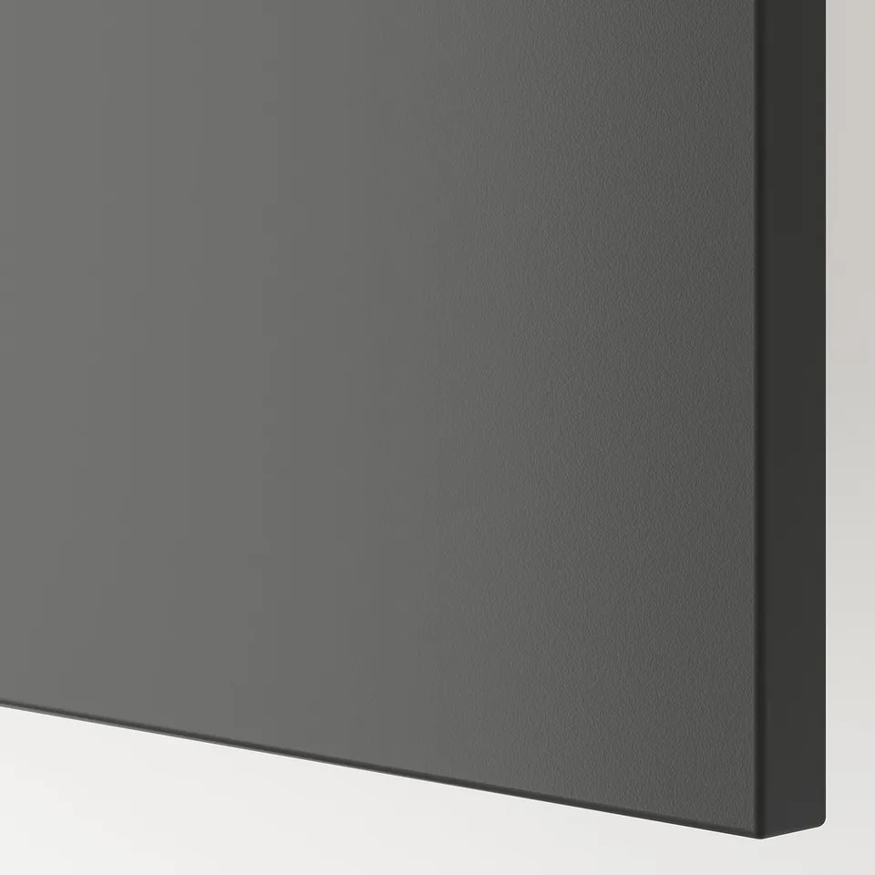 Close-up of sleek, dark grey BESTÅ cabinet showing smooth, sturdy surface and sleek edge.