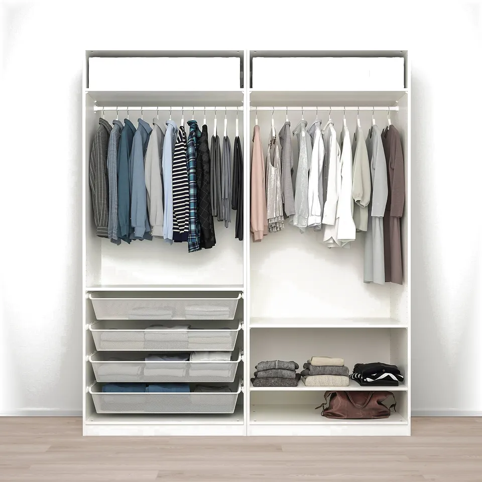 White PAX wardrobe with hangers, drawers, folded clothes, and bags. Adjustable dampened feet.