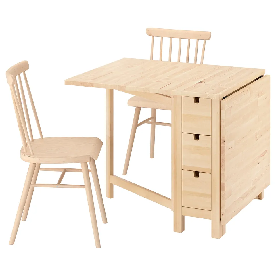 Light-colored natural wood folding table with 2 chairs, featuring drawers for storage.