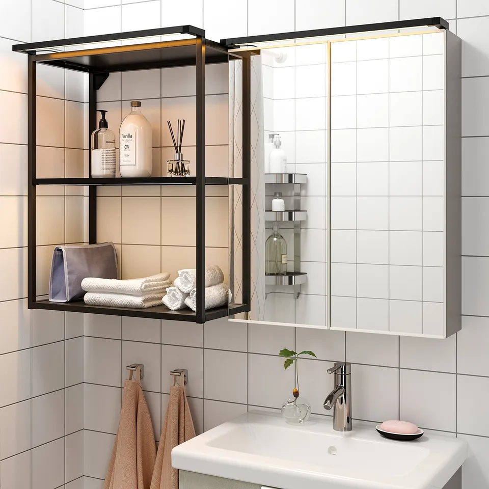 Modern bathroom with wall-mounted shelves, illuminated. Shelves hold toiletries and towels. White sink with chrome tap below.